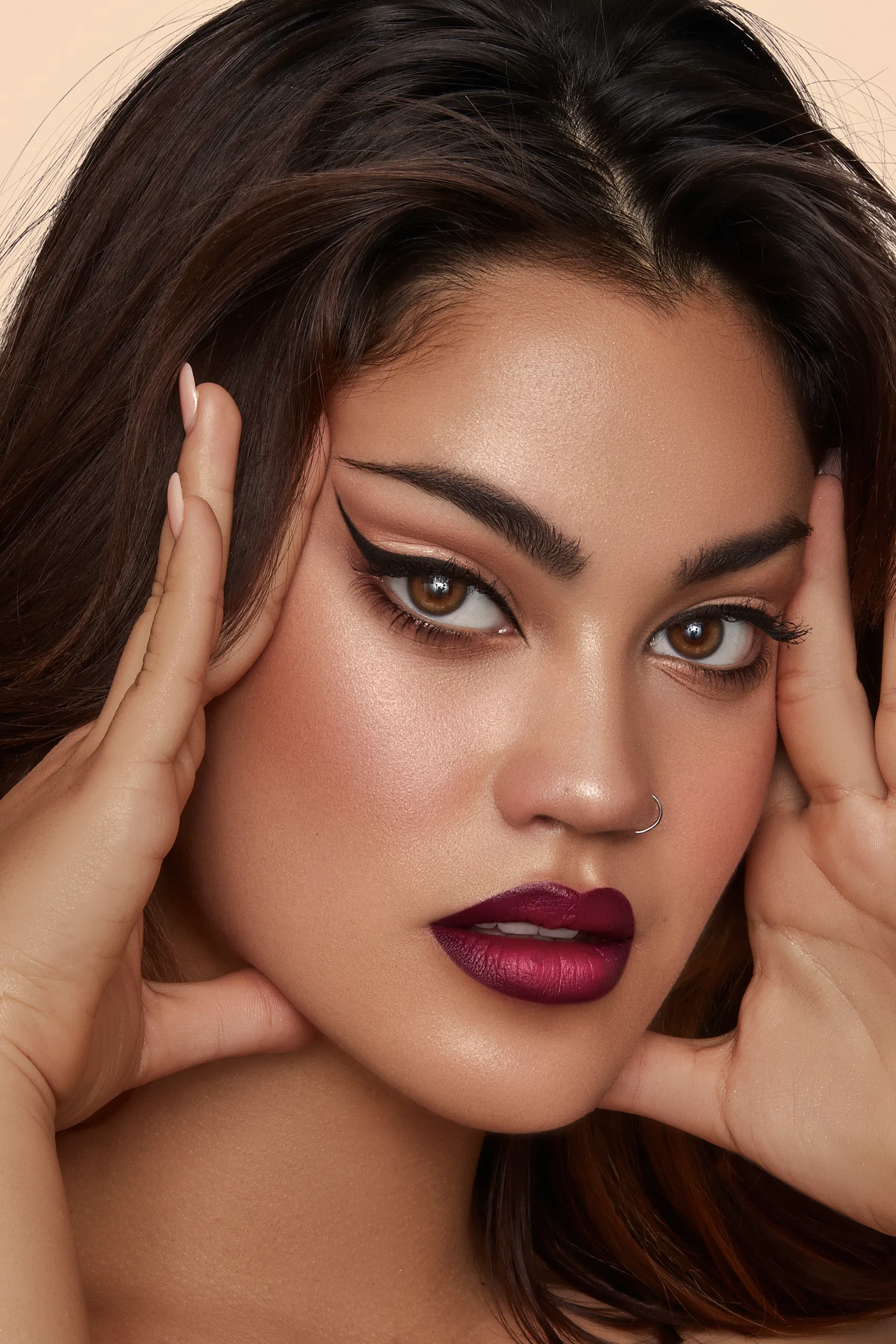 A close up of a woman with a red lipstick.