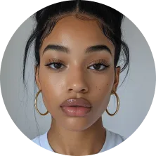 A woman with a ponytail and gold hoop earrings.
