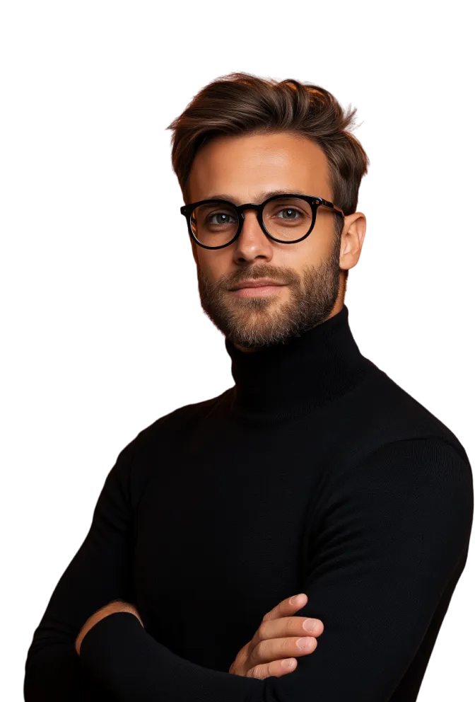 A man with a beard and glasses posing for a picture.
